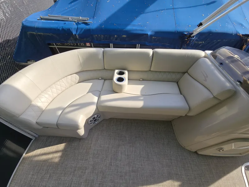 Slide: The Image of Luxurious seating on 2015 Bennington 24 SSRX30 pontoon boat with cup holders. - 27