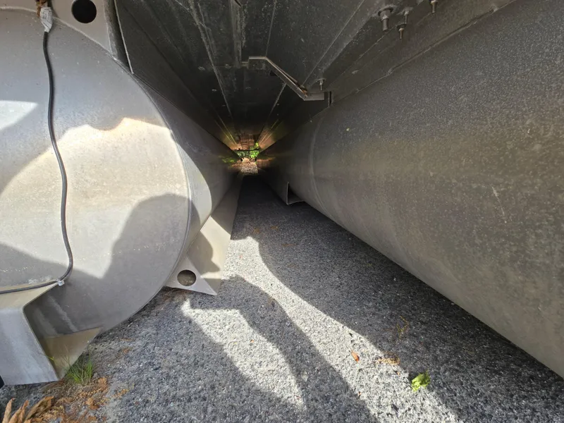 Slide: The Image of Underneath view of a 2015 Bennington 24 SSRX30 pontoon boat, showing pontoons and structure. - 40