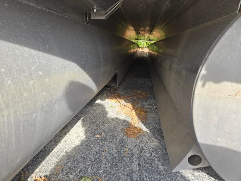 Slide: The Image of Underneath view of a 2015 Bennington 24 SSRX30 pontoon boat, showing pontoons and ground. - 41