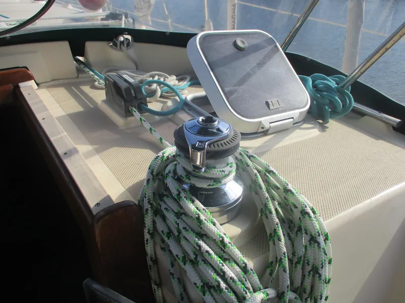 Slide: The Image of Sailboat deck of 1999 Island Packet 380 with winch and ropes. - 17