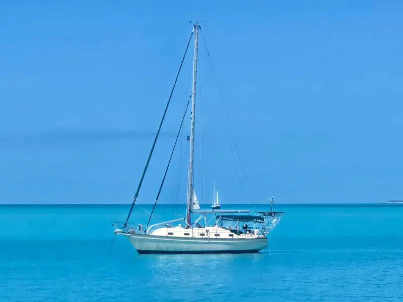 Slide: The Image of Sailboat Island Packet 380, 1999 model, anchored in clear blue ocean waters. - 2
