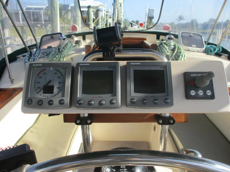 Slide: The Image of Cockpit of 1999 Island Packet 380 sailboat with navigation instruments and controls. - 21