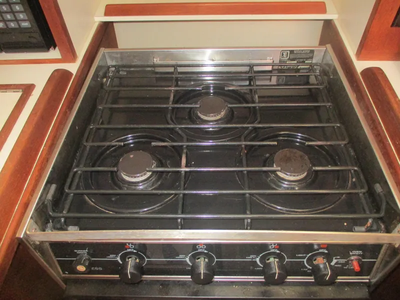 Slide: The Image of Three-burner stove in a 1999 Island Packet 380 yacht kitchen. - 30