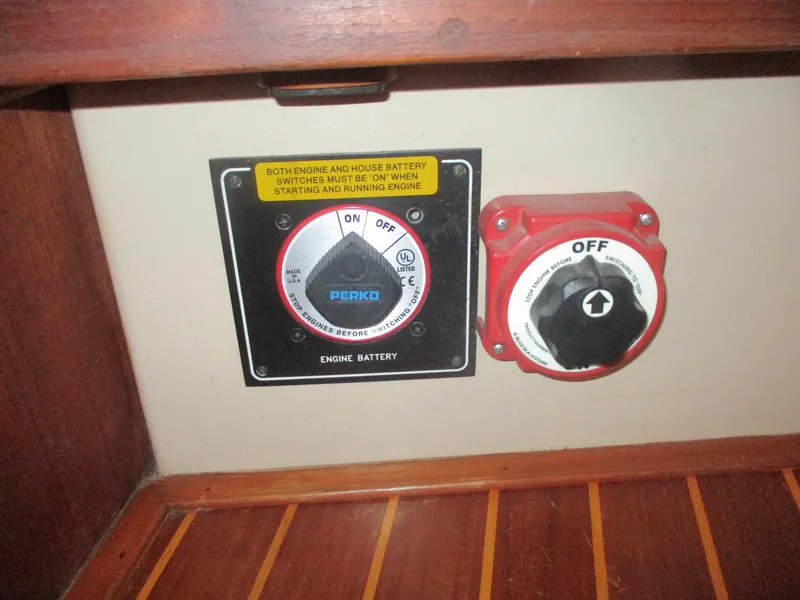 Slide: The Image of Battery switch panel on a 1999 Island Packet 380 sailboat, featuring Perko controls. - 35