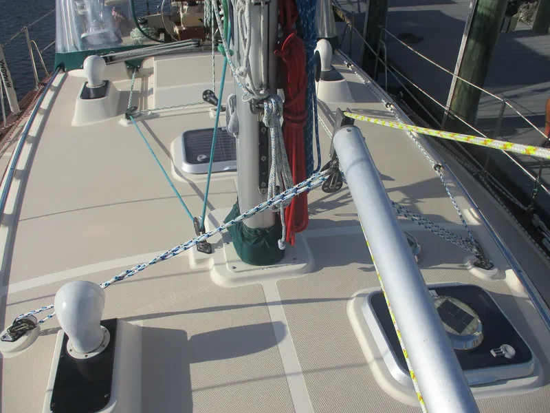 Slide: The Image of Deck view of a 1999 Island Packet 380 sailboat with rigging and hatches. - 9