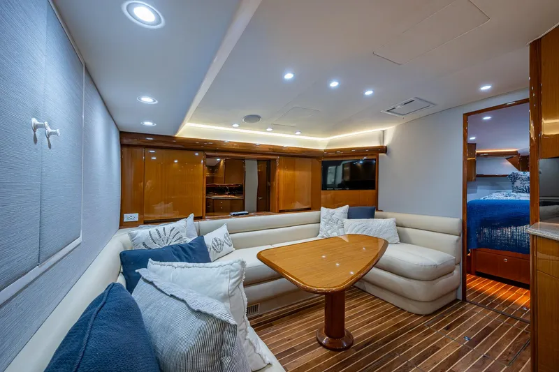 Slide: The Image of Luxurious interior of 2004 Viking Express Sport Fish yacht with plush seating and wooden accents. - 1