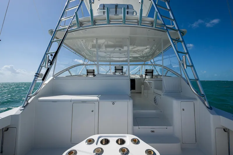 Slide: The Image of 2004 Viking Express Sport Fish boat with open deck and ocean view. - 21
