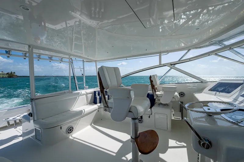 Slide: The Image of 2004 Viking Express Sport Fish boat interior with ocean view and modern seating. - 32