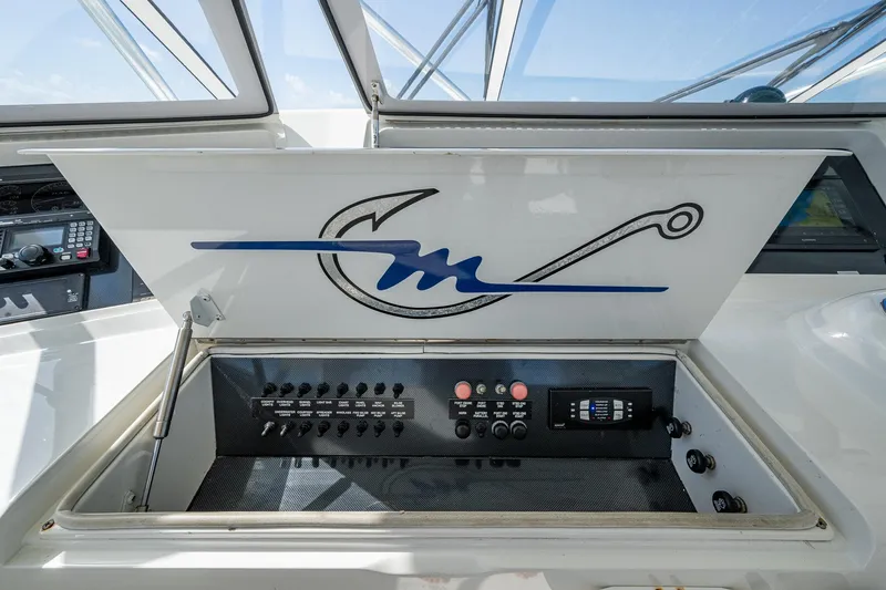 Slide: The Image of 2004 Viking Express Sport Fish control panel with fishing hook design. - 35