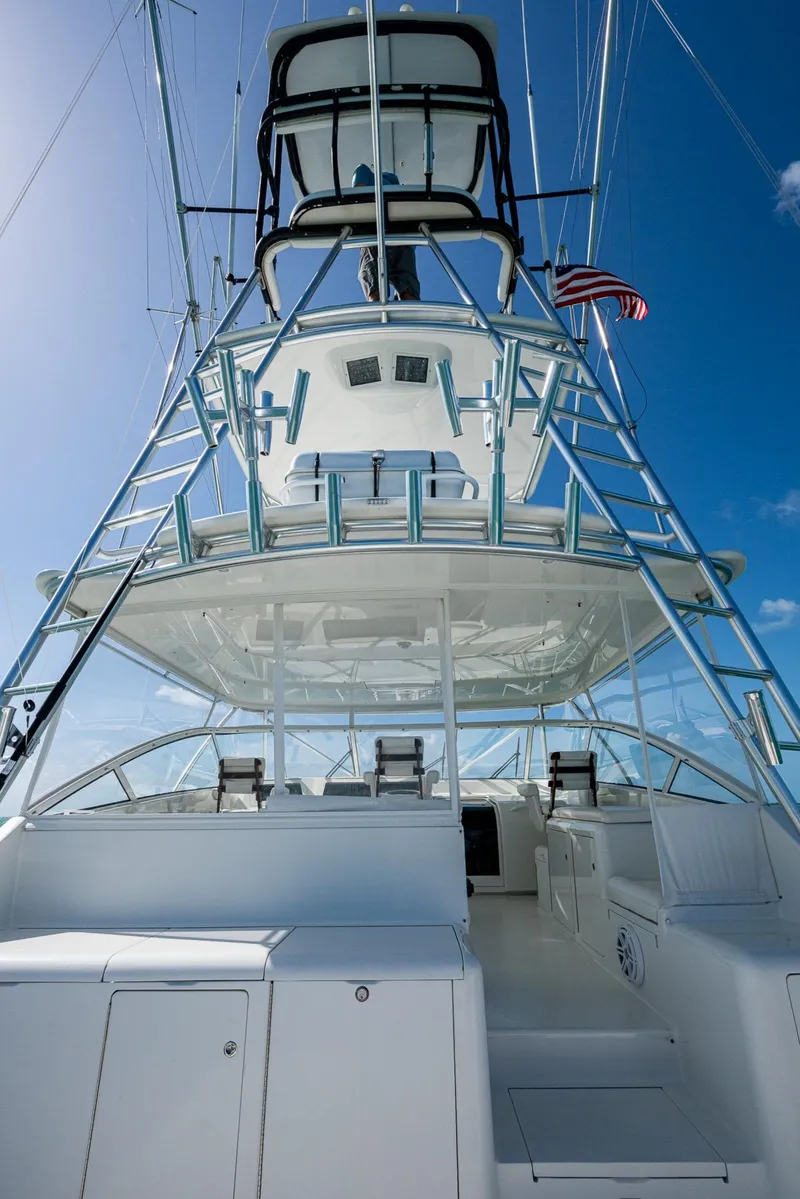 Slide: The Image of 2004 Viking Express Sport Fish yacht with tower against blue sky. - 39