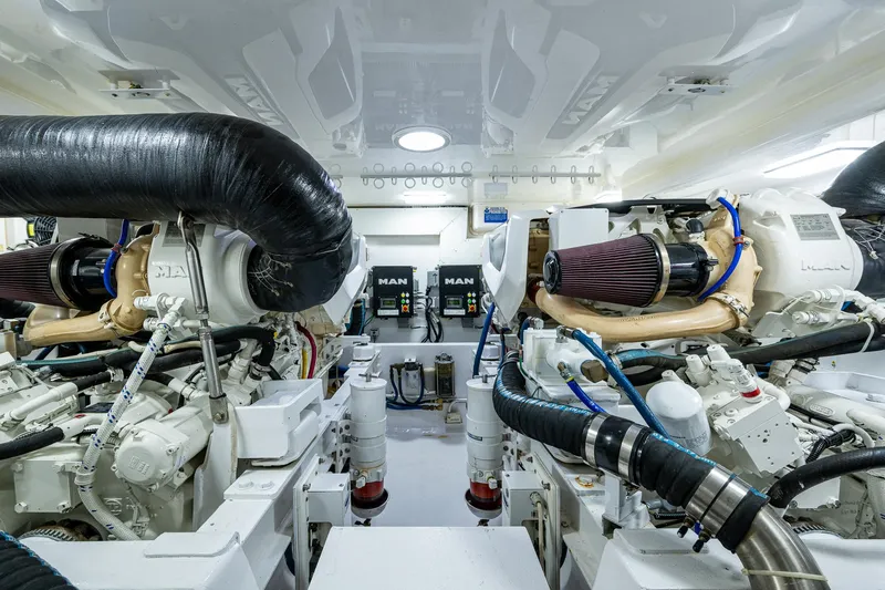 Slide: The Image of Engine room of 2004 Viking Express Sport Fish boat, featuring dual MAN engines. - 40