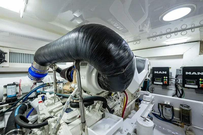 Slide: The Image of Engine room of 2004 Viking Express Sport Fish boat, featuring advanced machinery and components. - 41