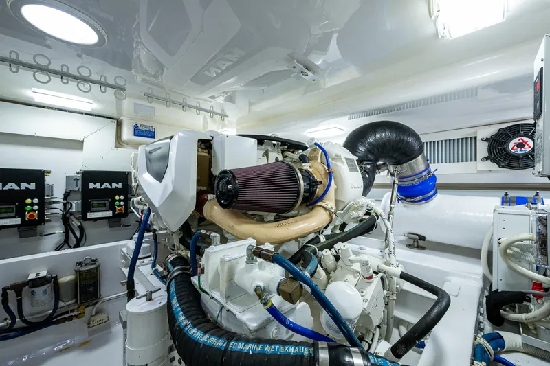 Slide: The Image of Engine room of 2004 Viking Express Sport Fish boat, featuring advanced machinery and equipment. - 42