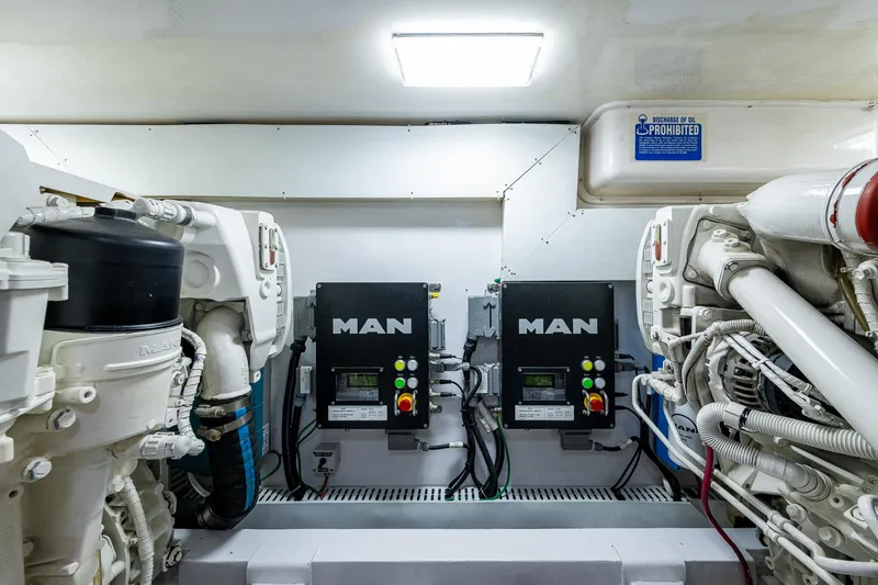 Slide: The Image of Engine room of 2004 Viking Express Sport Fish with MAN engines and control systems. - 43