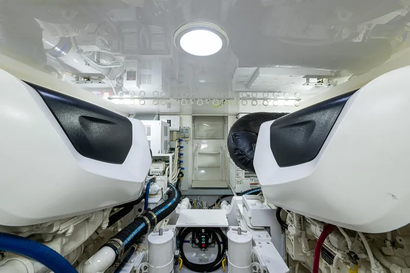 Slide: The Image of Engine room of 2004 Viking Express Sport Fish boat, showcasing machinery and components. - 44