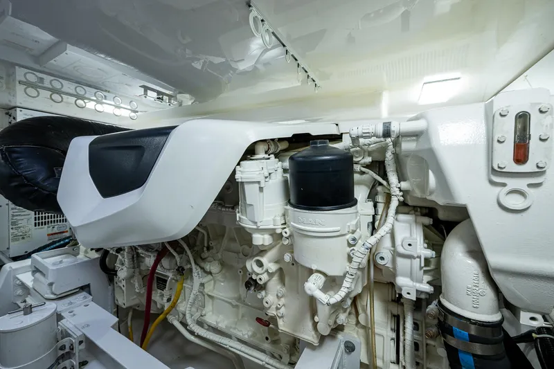 Slide: The Image of Engine room of 2004 Viking Express Sport Fish boat, showcasing detailed mechanical components. - 46