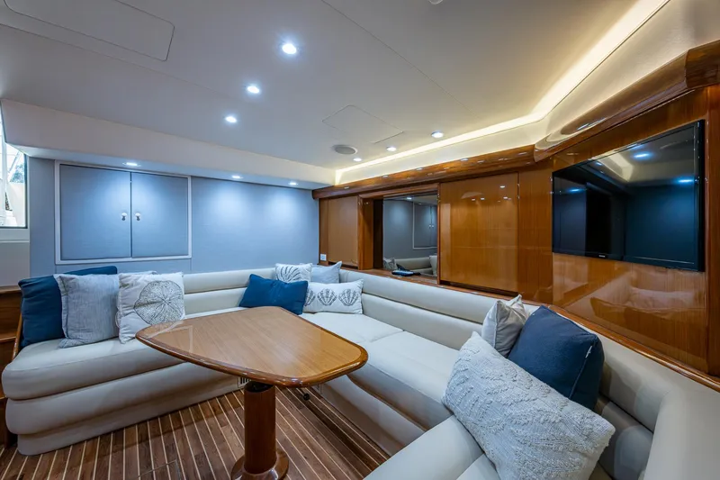 Slide: The Image of Luxurious interior of 2004 Viking Express Sport Fish yacht with plush seating and elegant wood finishes. - 5