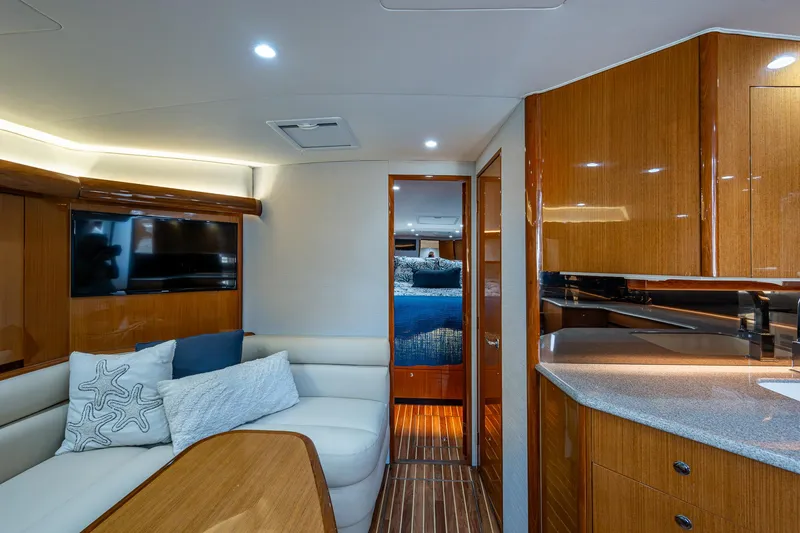 Slide: The Image of Luxurious interior of 2004 Viking Express Sport Fish yacht with modern furnishings and wood finishes. - 7