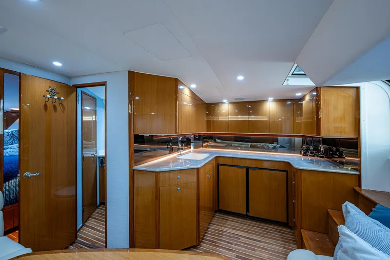 Slide: The Image of Luxurious interior of 2004 Viking Express Sport Fish yacht with modern kitchen design. - 8