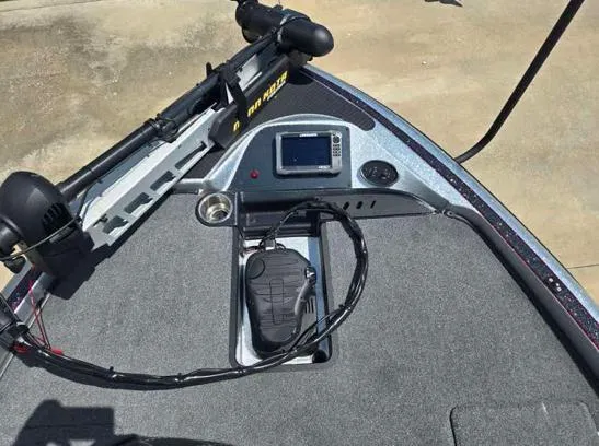 Slide: The Image of 2016 Triton 189 TRX boat dashboard with electronic controls and foot pedal. - 2