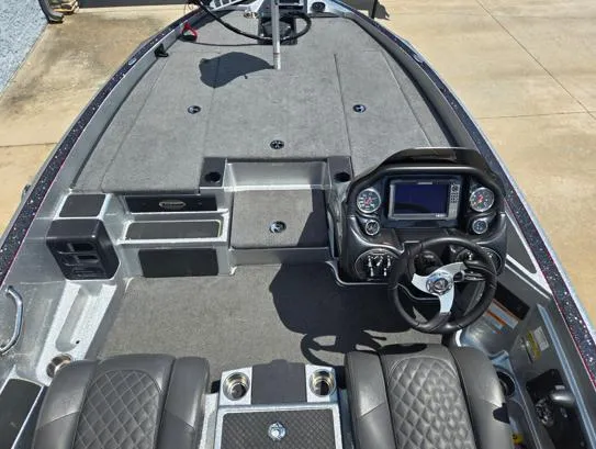 Slide: The Image of 2016 Triton 189 TRX boat interior with steering console and seating. - 5