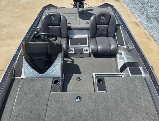 Slide: The Image of 2016 Triton 189 TRX boat interior with dual seats and steering console. - 6