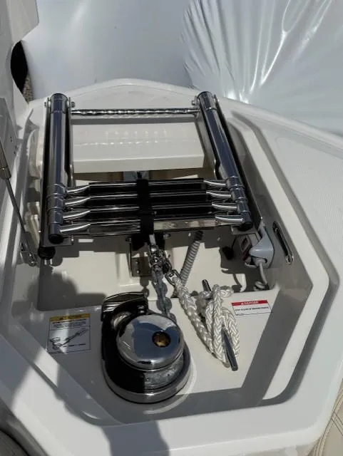 Slide: The Image of 2023 Boston Whaler 280 Dauntless anchor locker with ladder and rope storage. - 3