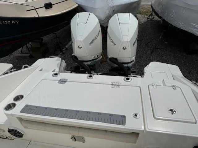 Slide: The Image of 2023 Boston Whaler 280 Dauntless with dual Mercury outboard engines, rear deck view. - 6