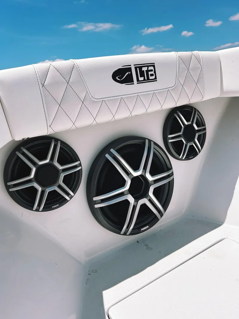 Slide: The Image of 2024 Latitude Tournament Boats LTB 25 with premium audio system and sleek design. - 8