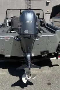 Slide: The Image of 2023 Smoker Craft Excursion 176 DC boat with 90 HP outboard motor, rear view. - 1