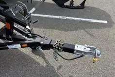 Slide: The Image of Trailer hitch of 2023 Smoker Craft Excursion 176 DC on asphalt parking lot. - 24