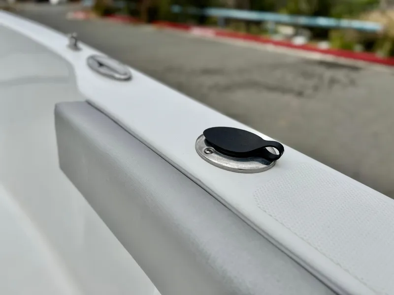 Slide: The Image of Close-up of a 2019 Caravelle Key Largo 2100 boat detail, featuring a sleek design. - 12