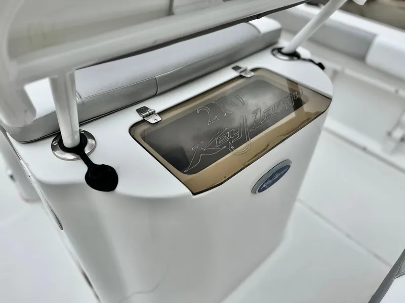 Slide: The Image of 2019 Caravelle Key Largo 2100 boat interior detail with storage compartment. - 14