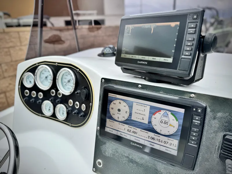 Slide: The Image of Dashboard of 2019 Caravelle Key Largo 2100 with Garmin navigation displays. - 17