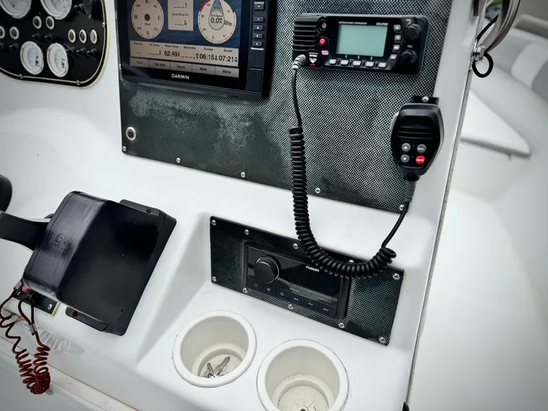Slide: The Image of Control panel of 2019 Caravelle Key Largo 2100 boat with navigation and communication equipment. - 18