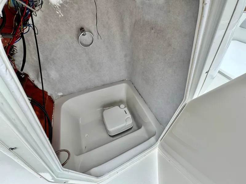 Slide: The Image of 2019 Caravelle Key Largo 2100 boat interior with compact toilet and wiring. - 20