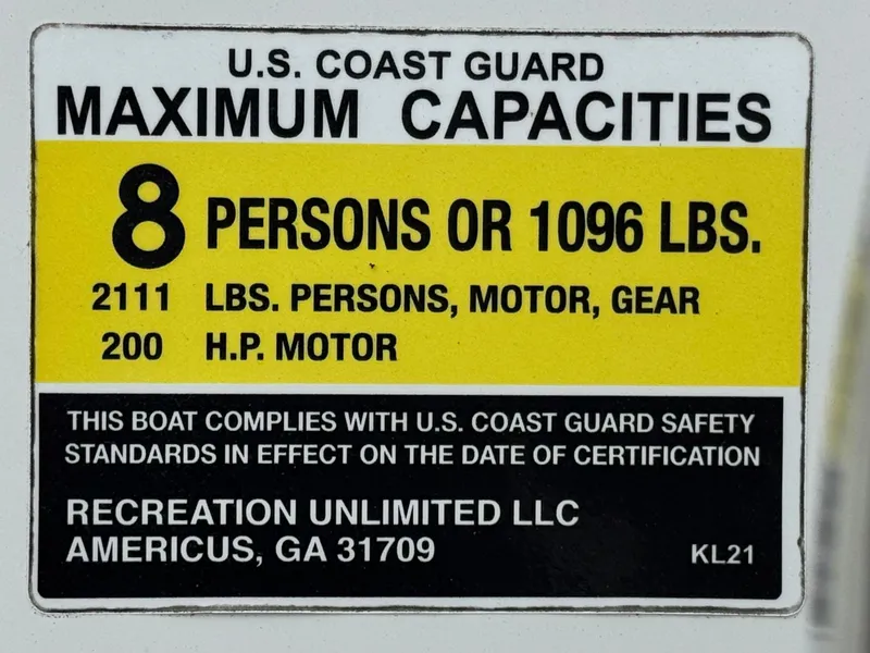 Slide: The Image of U.S. Coast Guard capacity label for Caravelle Key Largo 2100, 2019 model, 8 persons or 1096 lbs. - 21