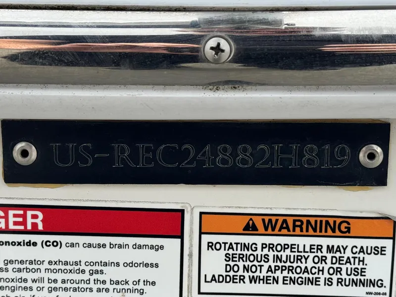 Slide: The Image of 2019 Caravelle Key Largo 2100 boat with warning labels and identification number. - 22