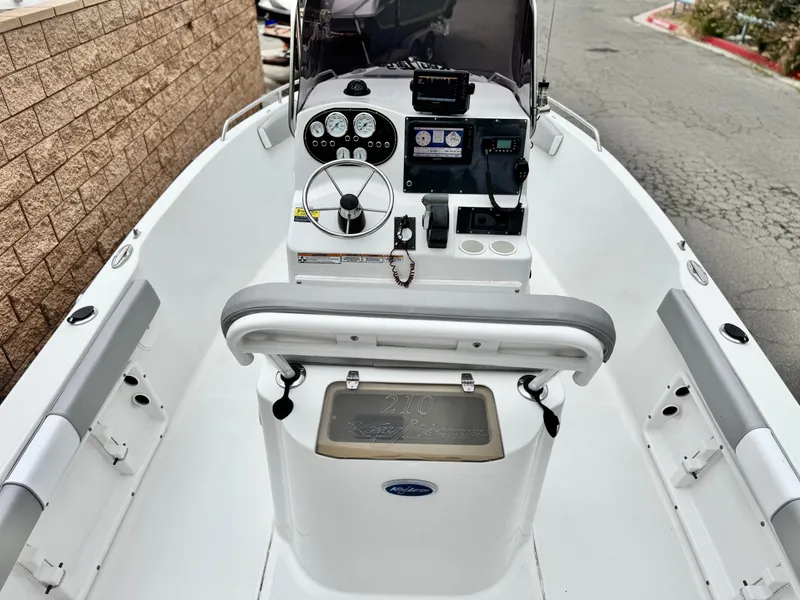 Slide: The Image of 2019 Caravelle Key Largo 2100 boat interior with steering console and navigation equipment. - 9