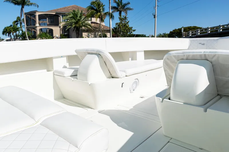 Slide: The Image of 2015 SeaVee 390Z boat interior with white seating and modern design. - 16