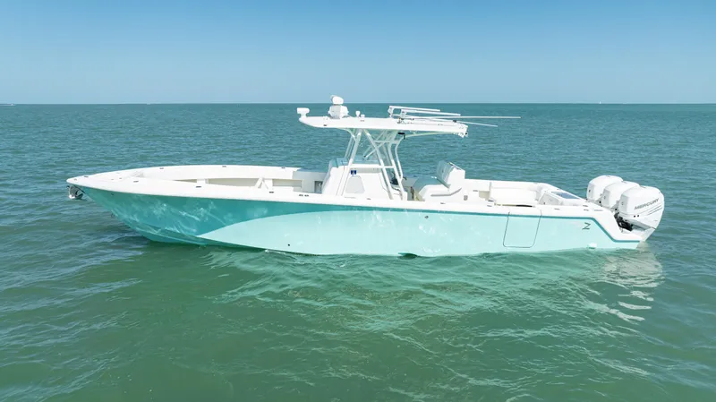 Slide: The Image of 2015 SeaVee 390Z boat on calm ocean waters, side view. - 2