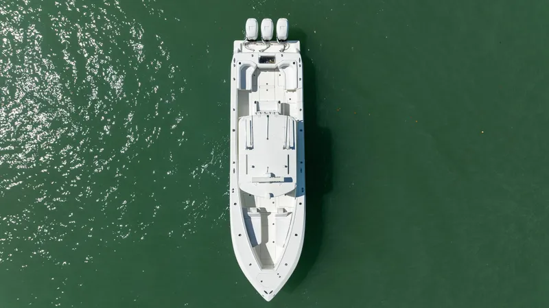 Slide: The Image of Aerial view of 2015 SeaVee 390Z boat on green water. - 3