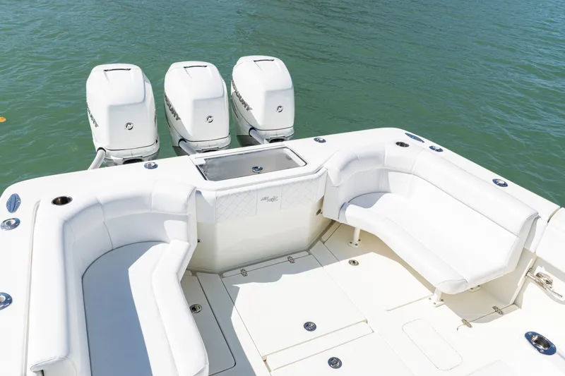 Slide: The Image of 2015 SeaVee 390Z boat with triple outboard engines and spacious seating area. - 34