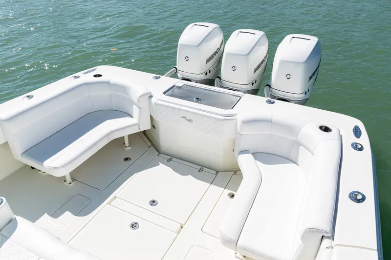 Slide: The Image of 2015 SeaVee 390Z boat with triple outboard engines and spacious seating area. - 35