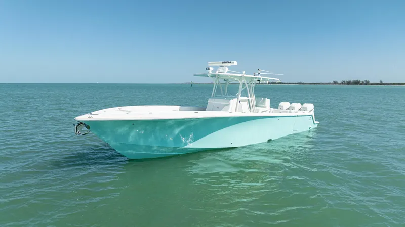 Slide: The Image of 2015 SeaVee 390Z boat on calm blue water under clear sky. - 4