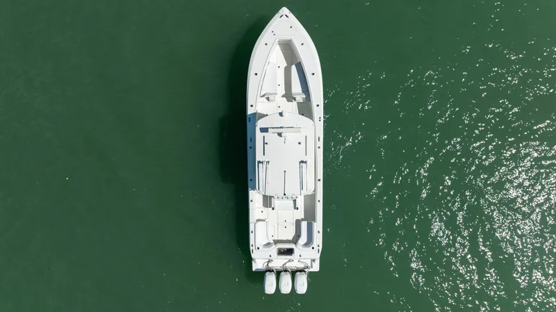 Slide: The Image of Aerial view of 2015 SeaVee 390Z boat on green water. - 46