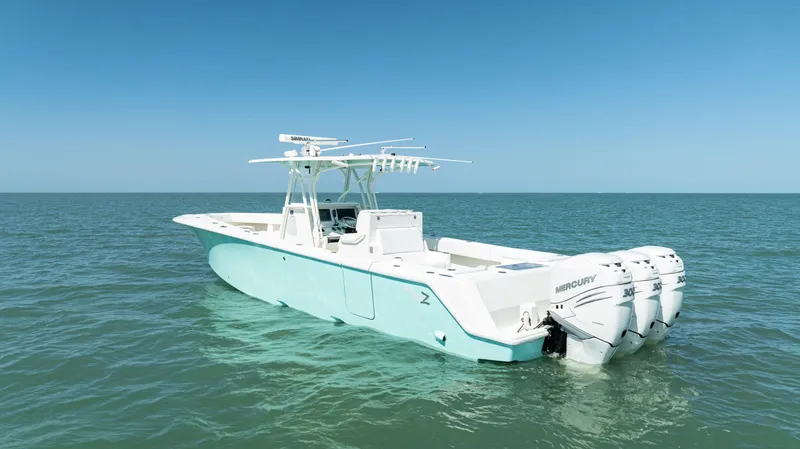 Slide: The Image of 2015 SeaVee 390Z boat with triple Mercury engines on open sea. - 6