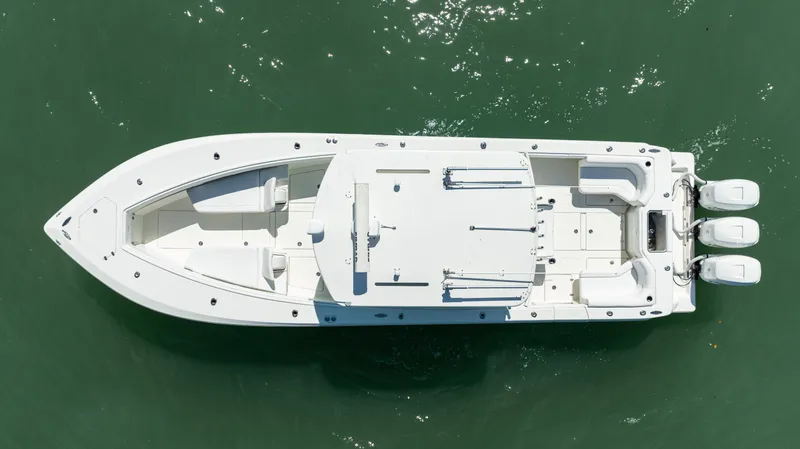 Slide: The Image of Overhead view of 2015 SeaVee 390Z boat with triple engines on green water. - 7