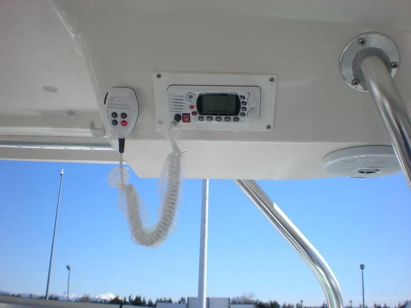 Slide: The Image of 2006 Seaswirl Striper boat radio and microphone under canopy, clear sky background. - 11