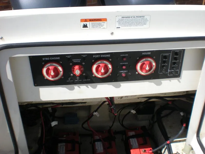 Slide: The Image of Control panel of a 2006 Seaswirl Striper boat with engine and battery switches. - 28